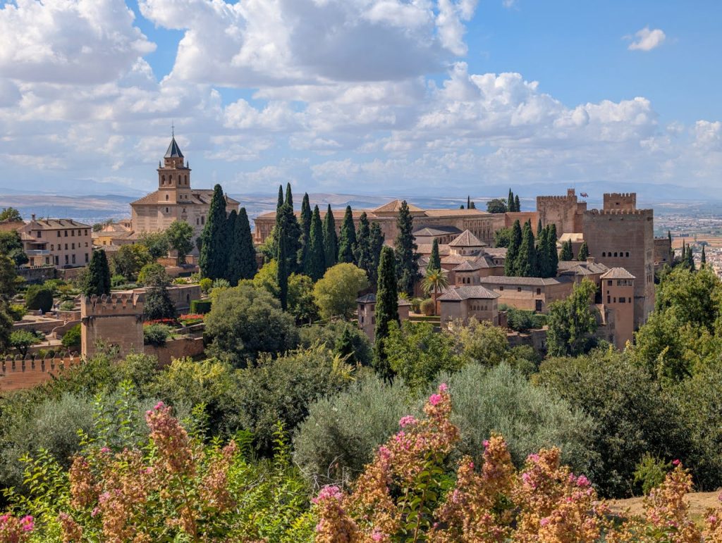 Breathtaking view of the Alhambra Palace and lush greenery in Granada.